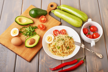Vegetarian Vegetable pasta Fusilli with zucchini, tomatoes and avocados. Raw vegan pasta. Spaghetti. Italian food. Italy. Roma. Fine dining. Healthy food. Fresca Pasta. Vegetarian. Healthy food