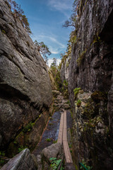 Narrow stone canyon called Peklo on the top of Table mountains, Szczeliniec Wielki in National Park Stolowe Mountains, Poland