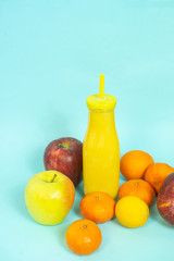 bottle of smoothie with fresh fruit