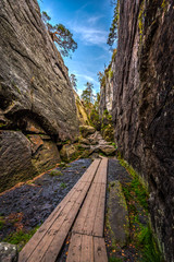 Narrow stone canyon called Peklo on the top of Table mountains, Szczeliniec Wielki in National Park Stolowe Mountains, Sudety, Poland  - obrazy, fototapety, plakaty
