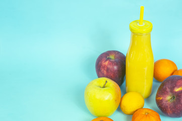bottle of smoothie with fresh fruit