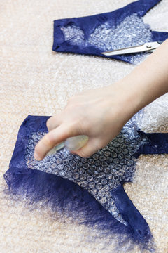craftsman wetting fibers on back side of glove