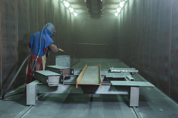Sandblast. Blasting metal.