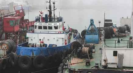 Tugboat is at the pier in the seaport. Cargo port Odessa, Ukraine