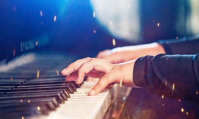 Close up of a musician playing a piano keyboard