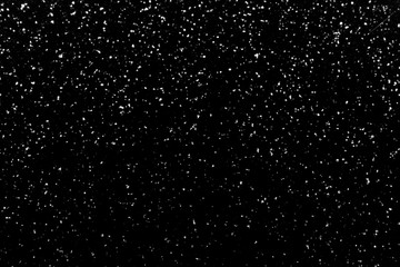Chaotic white bokeh on a black background, light spots texture, abstraction, falling snow, starry sky, bright glare of light texture 
