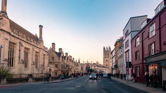 Time lapse zoom in view of Oxford high street towards Magdalen College before sunset