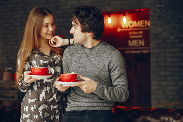 Cute couple spend time in a cafe