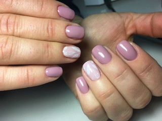 delicate pink manicure with white feathers