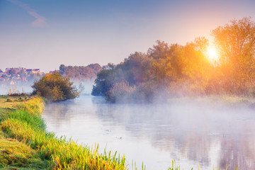 Fantastic foggy river in the sunlight. Location place Seret river, Ternopil.