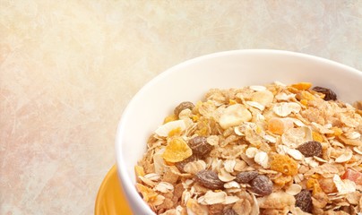 Bowl of  tasty corn flakes  on background
