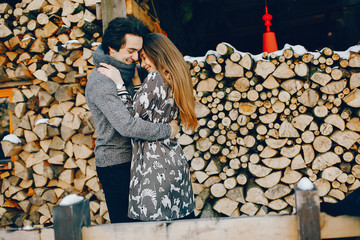 Loving couple standing in a winter park