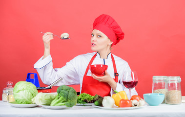 Eat healthy. Healthy ration. Girl wear hat and apron try mushroom taste. Woman professional chef hold spoon with raw mushroom. Healthy vegetarian and vegan recipes. Healthy raw food. Dieting concept