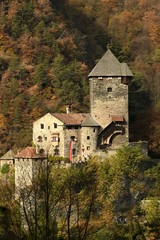 Fototapeta na wymiar Branzoll Castle or Torre del Capitano. The tower of the Captain is what remains of castel Branzoll, a thirteenth-century fortified building in Chiusa in South Tyrol, Italy.