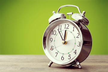Retro alarm clock on   background