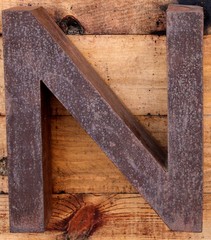 Letter N made of rusty iron