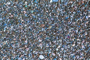 shiny ocean boulders wet by waves texture - pretty abstract photo background