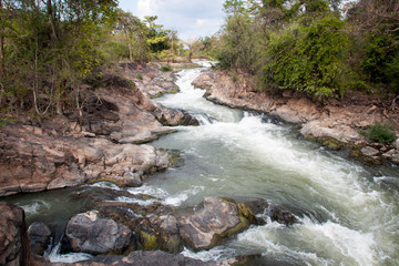 waterfall in a forest near don det, laos