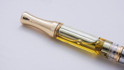 Naklejka premium THC/CBD Cannabis Oil & Terpenes Filled Cartridges Up Close White Background