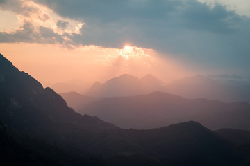 Sun through clouds from a mountain top in Laos