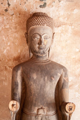 buddha statue with missing hands in laos