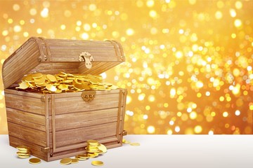 Treasure box with coins on background