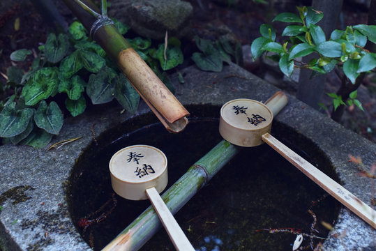 Close up of bamboo fountain with ladle