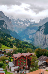 Wooden houses in the Murren mountains in Switzerland on a cloudy day