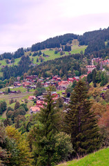 Wooden houses in the Murren mountains in Switzerland on a cloudy day
