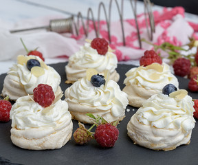 baked round meringues with whipped cream