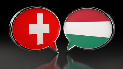 Fototapeta premium Switzerland and Hungary flags with Speech Bubbles. 3D illustration
