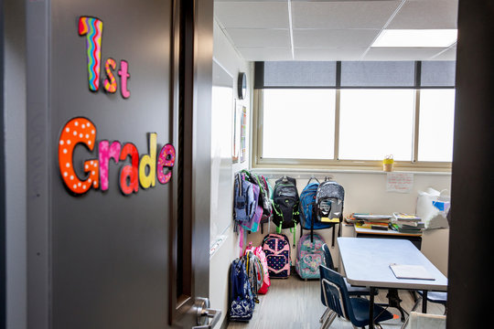 Backpacks hanging in classroom