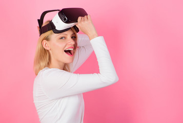 Funny woman experiencing 3D gadget technology - close up. Woman using virtual reality headset....