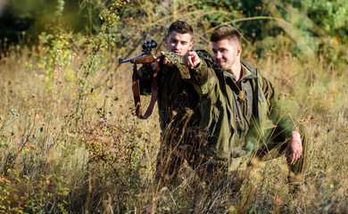 Hunting with friends hobby leisure. Hobby for real men concept. Hunters with rifles in nature...