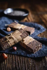 Photo sur Plexiglas Dessert Chocolate chia seeds bars with hazelnuts, rolled oats, dates, coconut and honey
