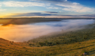 foggy canyon of a picturesque river. spring dawn