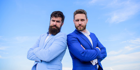 Bearded business people posing confidently. Business men stand blue sky background. Perfect in...