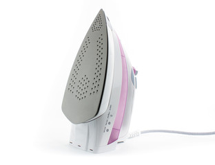 Steam iron laid on white background, elegant pastel pink model