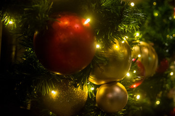 Christmas balls with the lights close-up in the evening