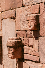 Side view of detailed stone head totem on Kalasayaya temple wall, Pumapunku, Tiwanaku, Bolivia