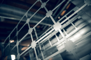 Industrial laser cut steel metal sheets in a cold hard industrial factory setting. Metal iron cut...
