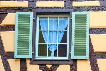 Fototapeta na wymiar Facades of colorful houses in Alsace in northern France on a sunny day