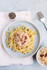 Italian tagliatelle with cream sauce from sun-dried tomatoes 