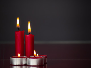Concept of love Red candles lit with a gray background