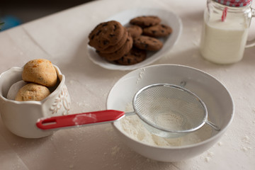 new year mood. glass of milk. cookie. Christmas gingerbread. gingerbread with milk. flour sieve