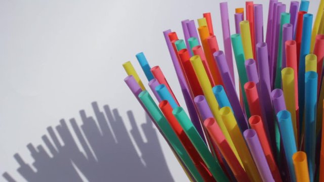 straw straws plastic background disposable drinking straw with copy space environmental waste single use footage 