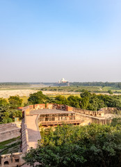 A view from Agra Red Fort window with fields and Taj Mahal in background - Agra, Uttar Pradesh, India