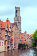 Fototapeta na wymiar Streets of Bruges in Belgium with its medieval style facades on a cloudy day.