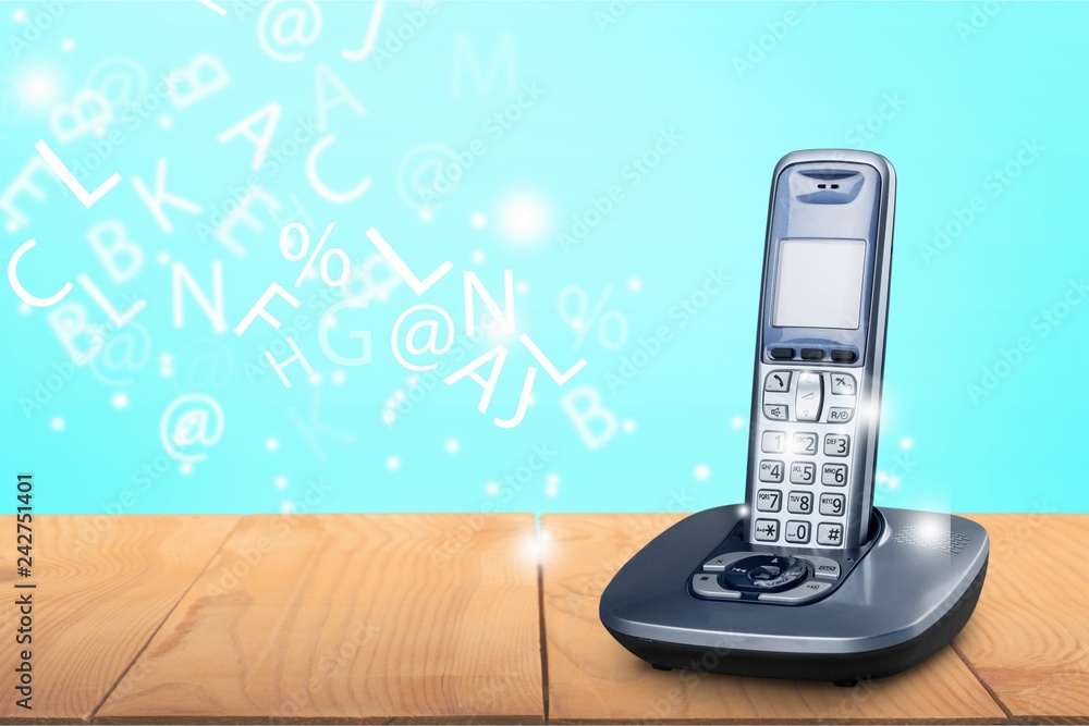 Poster Cordless phone with cradle on white background