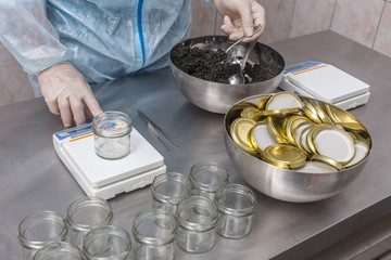 Weighing the glass jar